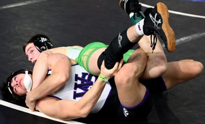 Drew Gorman from Bufford topples Winter Springs senior Ryan Phillips in a 138-pound semifinal on Saturday at the Knockout Christmas Classic at Silver Spurs Arena in Kissimmee.